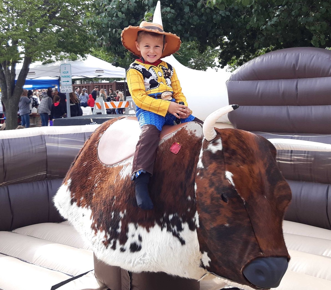 Cowboy kiddo riding mechanical bull